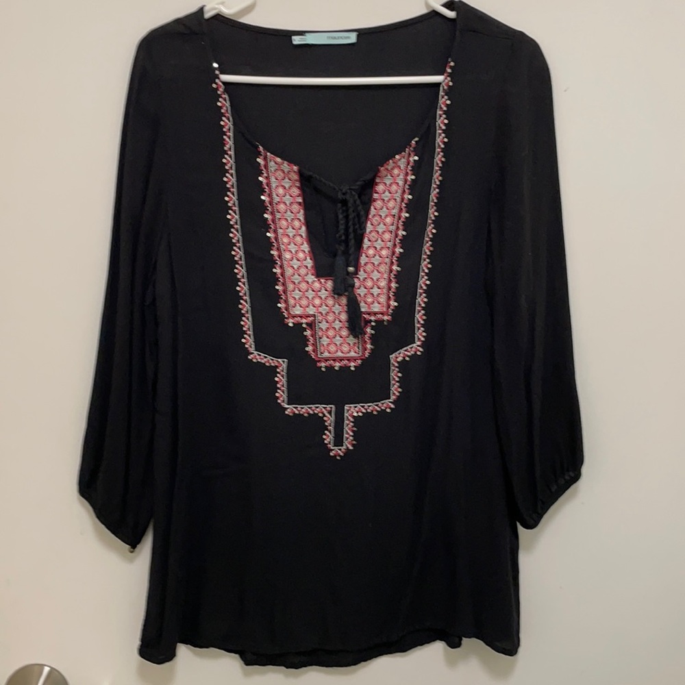 Black tunic, ties, pink&white stitching, sequins.